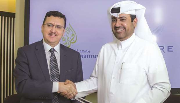 Aspire Logistics director general Abdullah Nasser al-Naemi (right) and Al Jazeera Media Institute director Mounir al-Daymia.