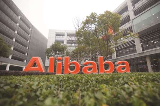 A signage is displayed outside the headquarters of Alibaba.comu2019s in Hangzhou. China took a major step towards seeing Alibaba, Baidu and others list in its domestic market, announcing a trial programme that would allow the technology giants to see their shares bought and sold in the worldu2019s most populous country.