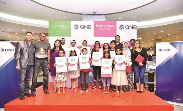 Babyshop and QNB officials with the winners.