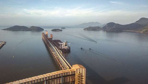 A Porto Sudeste do Brasil conveyor belt loads iron ore into a bulk carrier vessels at a port in Rio de Janeiro (file). With Brazilian economists cutting their growth forecasts for the Latin American giant, the countryu2019s top policy makers welcomed an upward revision by the International Monetary Fund, while downplaying the fact its estimate remains lower than others.