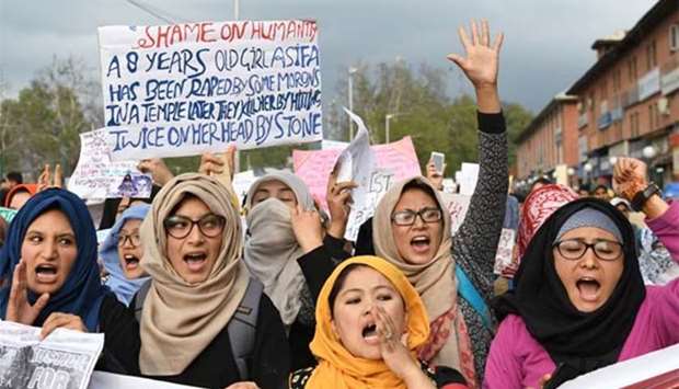 Students hold placards and shout slogans in Srinagar last week during a protest following the recent rape and murder of an eight-year-old girl in the Indian state of Jammu and Kashmir.