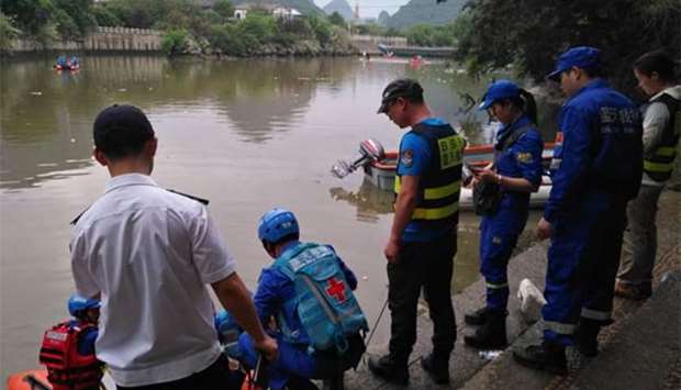 Rescuers patrol to look for missing people after two boats capsized in Guilin in southern China.