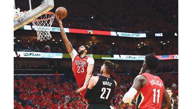 Anthony Davis of the New Orleans Pelicans shoots over Jusuf Nurkic of the Portland Trail Blazers during the second-half of Game Four of the first round of the Western Conference playoffs at the Smoothie King Centre in New Orleans, Louisiana. The Pelicans defeated the Trail Blazers 131-123 to sweep the series 4-0. (Getty Images/AFP)