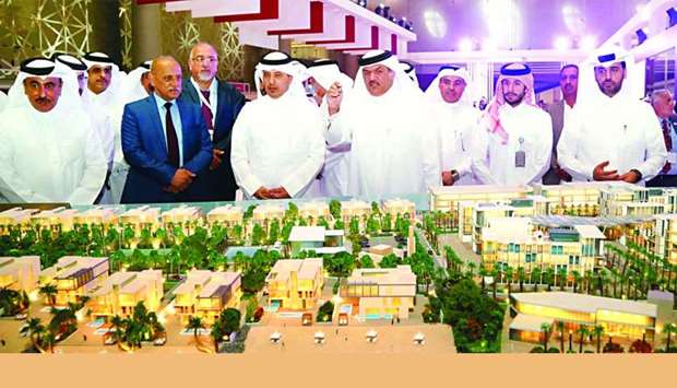 HE the Prime Minister and Interior Minister Sheikh Abdullah bin Nasser bin Khalifa al-Thani views the scale model of the 'Gewan Island' project after the unveiling ceremony held at Cityscape Qatar 2018 yesterday. PICTURE: Jayan Orma.