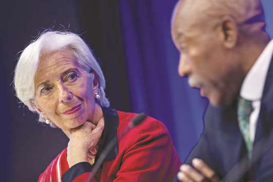 IMF managing director Christine Lagarde (left) listens as Lesetja Kganyago, governor of South Africau2019s reserve bank, speaks during a International Monetary Fund Committee (IMFC) news conference at the spring meetings of the IMF and World Bank in Washington, DC, on Saturday. u201cWe know that corruption hurts the poor, hinders economic opportunity and social mobility, undermines trust in institutions and causes social cohesion to unravel,u201d Lagarde said in a statement yesterday.