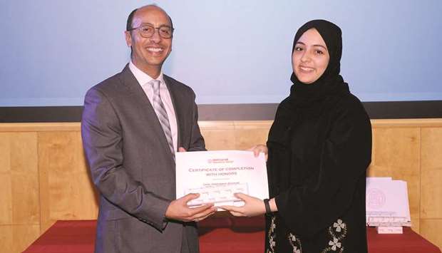 HONOURED: Latifa Mahmoud, right, of Al Bayan Secondary School for Girls was awarded a certificate of completion with honours in all modules.