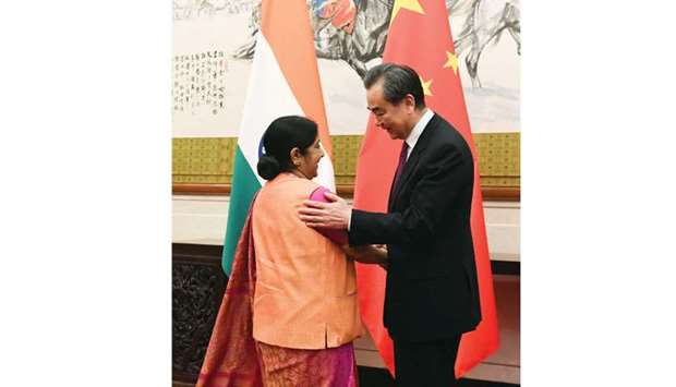 External Affairs Minister Sushma Swaraj shakes hands with Chinese Foreign Minister Wang Yi at the Diaoyutai State Guest House in Beijing yesterday.