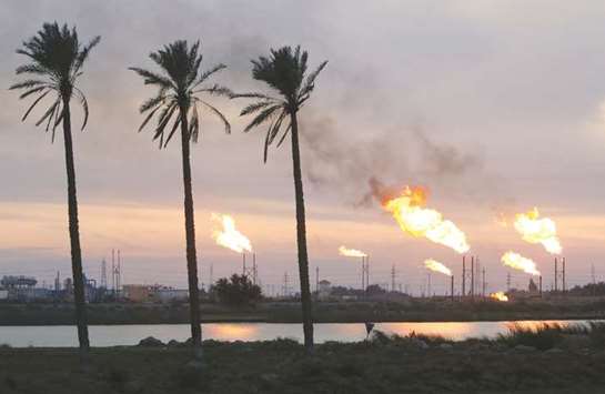 Flames emerge from flare stacks at the oil fields in Basra, Iraq (file). Talks between ExxonMobil and Iraq on a multi-billion-dollar infrastructure contract have reached an impasse, Iraqi officials and two industry sources said, in a potential setback to the oil majoru2019s ambitions to expand in the country.