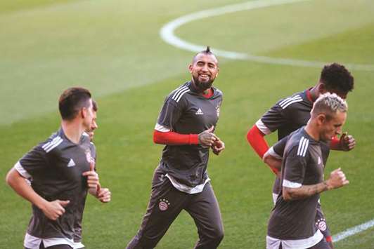 Bayern Munichu2019s Arturo Vidal (second from left) runs with teammates during a training session in Sevilla on the eve of the UEFA Champions League quarter-final against Sevilla yesterday. (AFP)