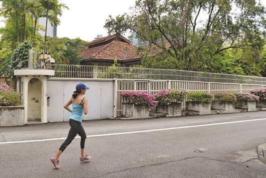 A woman jogging past the house of Singaporeu2019s late prime minister Lee Kuan Yew on 38 Oxley Road in Singapore.
