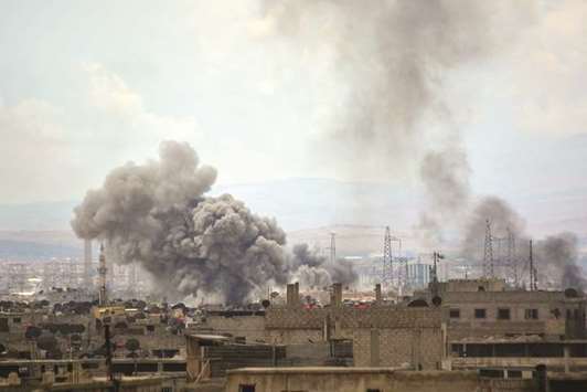 A picture taken yesterday, shows smoke billowing from the Palestinian camp of Yarmouk, south of the Syrian capital Damascus, during regime strikes targeting the Islamic State group in the camp.