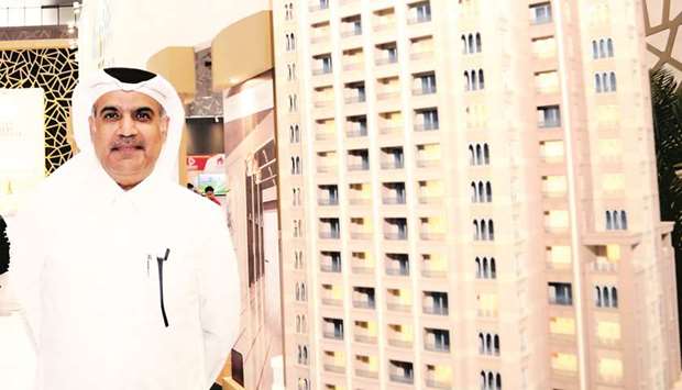 JRE chairman Nasser al-Ansari presents the scale model of the companyu2019s latest project, the Baywalk Tower during day one of Cityscape Qatar 2018. PICTURE: Jayan Orma