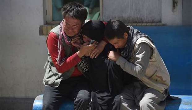 Kabul was rocked by a suicide bomb attack outside a voter registration centre last week. Picture shows residents weeping for their relatives.