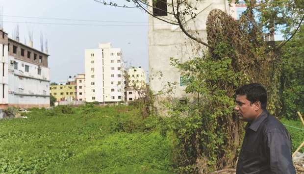 Journalist Nazmul Huda standing on the the site of the former Rana Plaza garment complex in Savar, northwest of Dhaka.