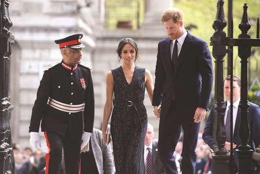 Prince Harry and his fiancee Meghan Markle arrive at a service at St Martin-in-The Fields to mark 25 years since Stephen Lawrence was killed in a racially motivated attack, in London yesterday.