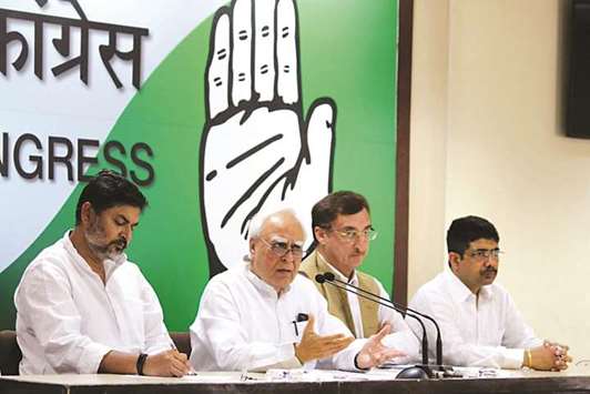 Congress leader Kapil Sibal addresses a press conference in New Delhi yesterday. Sibal said his party woukd appeal the decision by the vice-president to reject a bid to impeach the chief justice, declaring it illegal.
