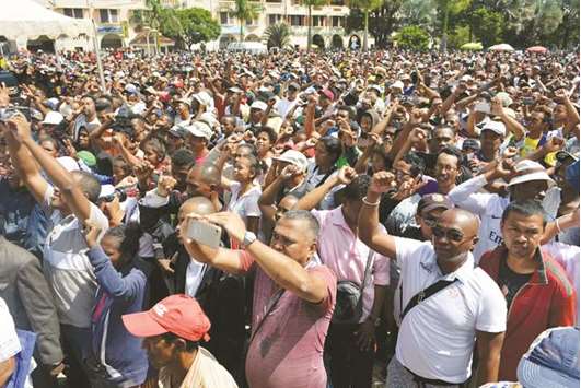 Madagascar demonstrators from the opposition chant slogans during a protest in Antananarivo yesterday.
