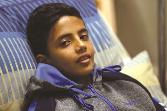 Abdel Rahman Nawfal, 12, sits in a hospital bed in the West Bank city of Ramallah, yesterday.