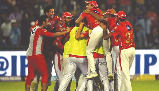 Kings XI Punjab players celebrate after their win over Delhi Daredevils in Indian Premier League at the Feroz Shah Kotla cricket stadium in New Delhi yesterday. Punjab won by four runs. (AFP)