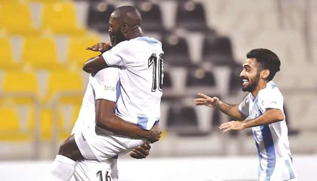Al Wakrahu2019s Prince Ibara (centre) celebrates with teammates after scoring against Qatar SC in the first round of HH The Emir Cup at the Suheim bin Hamad Stadium yesterday. PICTURE: Noushad Thekkayil