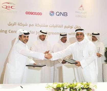 Ooredoo and Qatar Rail officials at the partnership signing.