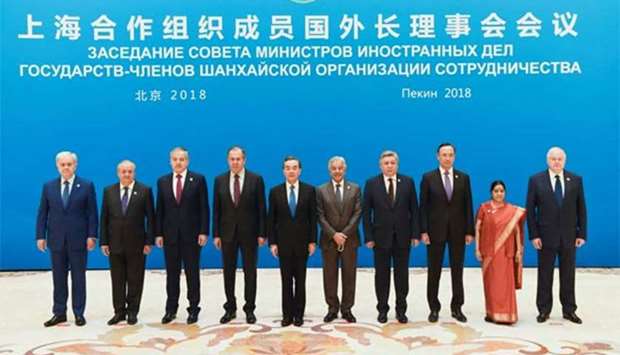 Foreign ministers and officials of the Shanghai Cooperation Organisation pose for a group photo before a meeting at the Diaoyutai State Guest House in Beijing on Tuesday.