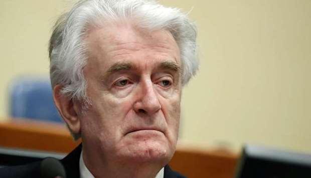 Former Bosnian Serb leader Radovan Karadzic appears in a courtroom before the International Residual Mechanism for Criminal Tribunals (MICT), which is handling outstanding war crimes cases for the Balkans and Rwanda, in The Hague, Netherlands.