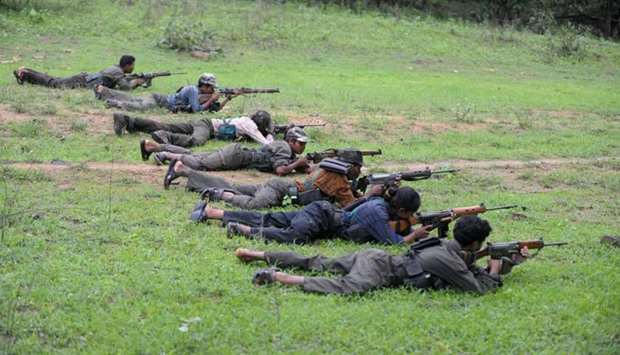 Indian Maoists ready their weapons as they take part in a training camp in Bijapur district in Chhattisgarh. File photo taken on July 8, 2012. AFP