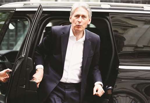 Britainu2019s Chancellor of the Exchequer Philip Hammond arrives in Downing Street, London. Hammond has made fixing the public finances his priority, although he has taken a slower approach than previous finance minister George Osborne who inherited a deficit equivalent to just under 10% of GDP in 2010.