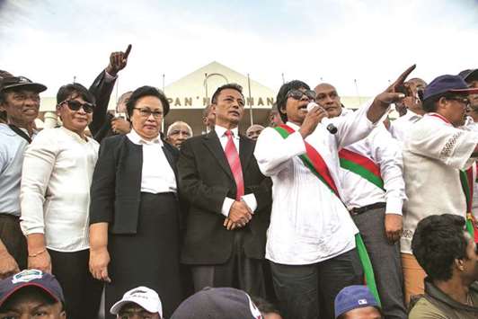 Former Madagascar president Marc Ravalomanana and his wife and Mayor of Antananarivo Lalao Ravalomanana (third left) look on as opposition supporters and deputies at the u201cMay 13 Squareu201d in Antananarivo to offer their condolences to the families of victims killed in protests on April 21.