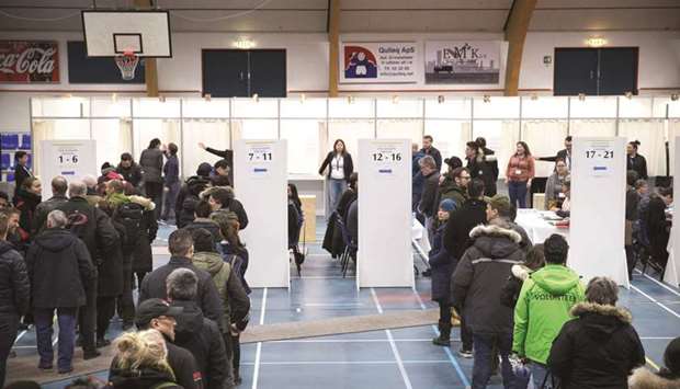 Voters at a polling station in Godthaabshallen in Nuuk, Greenland.