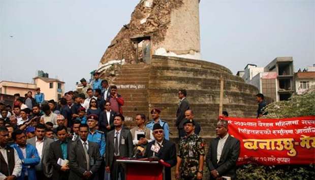 Nepal's Prime Minister Khadga Prasad Sharma Oli delivers a speech to mark the third anniversary of the 2015 earthquake in front of the historic Dharahara tower that fell during that earthquake, in Kathmandu on Wednesday.