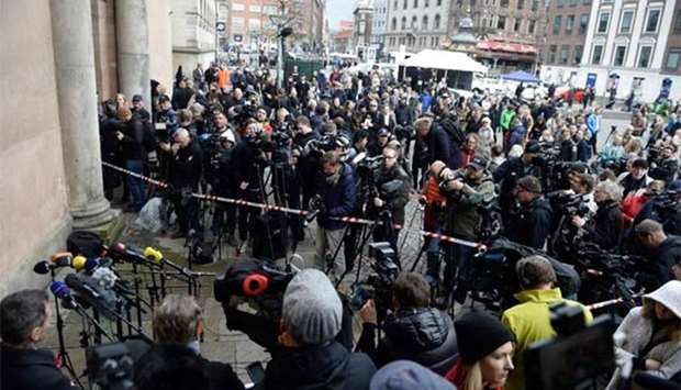 Members of the media wait in front of the courthouse in Copenhagen on Wednesday.