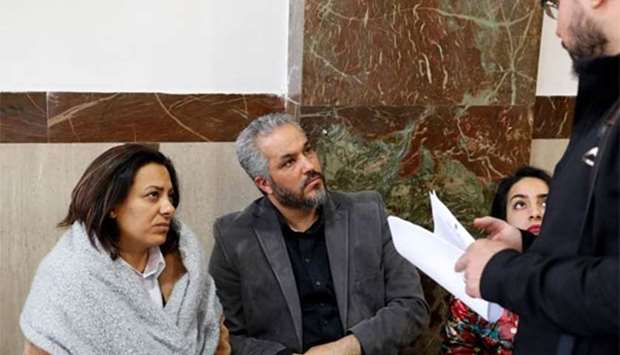 The parents of late Palestinian teenager Nadim Nuwara, who was killed during clashes by an Israeli policeman in 2014 in Beitunia in the occupied West Bank, are seen at the district court in Jerusalem on Wednesday.