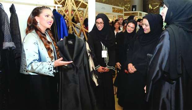 Dr Sheikha Aisha al-Thani (2nd, right), along with Jawaher al-Khuzaei and other dignitaries, touring various pavillions at the 13th Heya Arabian Fashion Exhibition, which opened on Wednesday. PICTURES: Thajudheen.