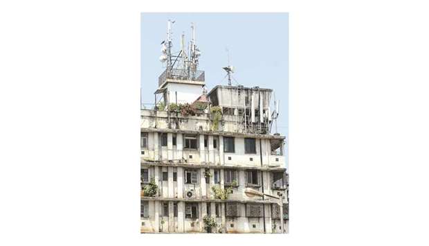 Numerous mobile masts are seen on the roof of a residential apartment block in Mumbai. Indiau2019s Bharti Infratel and Indus Towers said yesterday that they had agreed to merge in a deal that will create the worldu2019s second-largest mobile mast company.