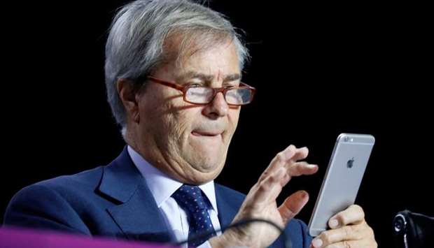 Vincent Bollore, Chairman of the Supervisory Board of media group Vivendi checks his mobile phone while attending the company's shareholders meeting in Paris, France on April 19.