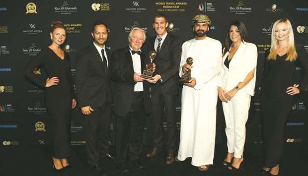 Oman Air officials with the awards.