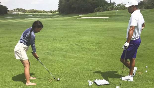 Tiger Woods coaching Pratima Sherpa at Medalist Golf Club in Jupiter, Florida, the United States.