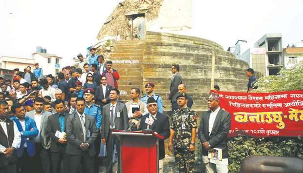 Prime Minister K P Sharma Oli delivers a speech to mark the third anniversary of the 2015 earthquake that killed around 9,000 people, in front of the historic nine-storey Dharahara tower that fell during that earthquake, in Kathmandu yesterday.