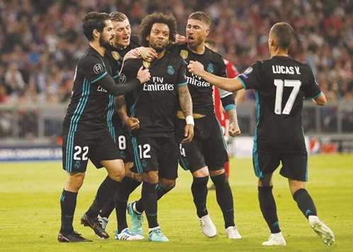 Real Madridu2019s Marcelo (centre) celebrates with team-mates after scoring against Bayern Munich during the Champions League semi-final first-leg on Wednesday. (AFP)
