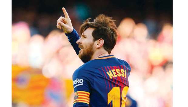 In this photo taken on March 18, 2018 Barcelonau2019s forward Lionel Messi celebrates after scoring during the La Liga match against Athletic Club Bilbao in Barcelona. (AFP)