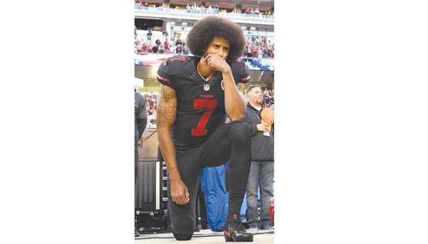 In this October 5, 2016, picture, Colin Kaepernick of San Francisco 49ers kneels in protest during the national anthem prior to the NFL game against Arizona Cardinals in Santa Clara, California. (AFP)