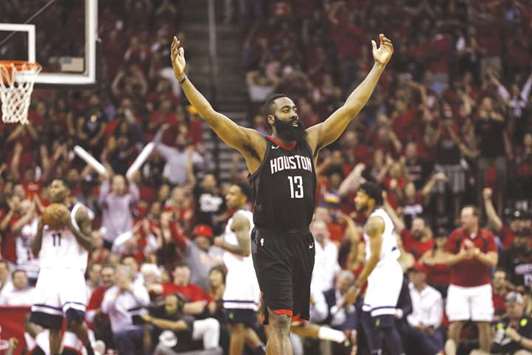 James Harden of the Houston Rockets celebrates in the second half during Game Five of the first round of the 2018 NBA Playoffs against the Minnesota Timberwolves in Houston, Texas, on Wednesday. (AFP)