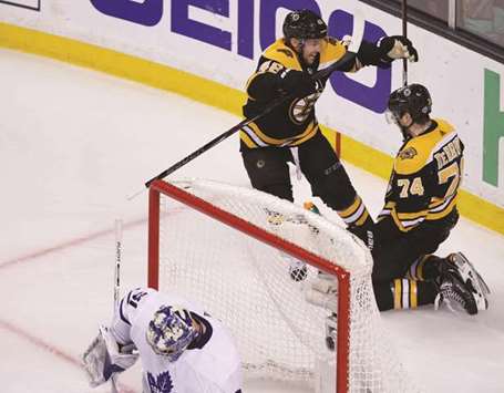 Boston Bruinsu2019 Matt Grzelcyk (centre) congratulates teammate Jake DeBrusk (right) after scoring a goal against Toronto Maple Leafs in game seven of the first round of the 2018 Stanley Cup Playoffs in Boston, Massachusetts, on Wednesday. (USA TODAY Sports)