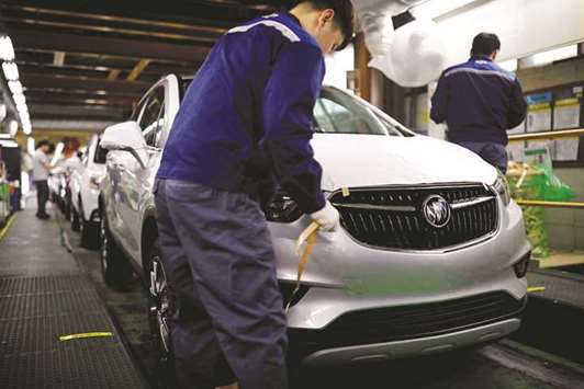 An employee works at an assembly line of GM Koreau2019s Bupyeong plant in Incheon. GM Korea has announced plans to close one of its four South Korean plants and let go 2,600 workers.