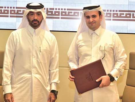 Dr Mohamed Diab and Dr Ahmed Mohamed al-Sulaiti at the MoU signing yesterday.