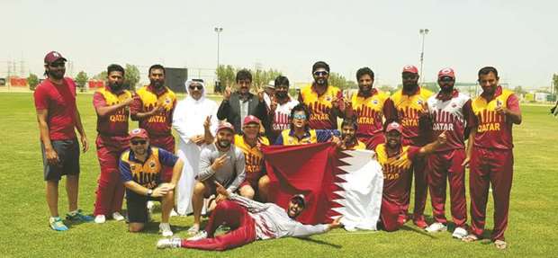 Qatar cricket team players and officials celebrate after their win over Bahrain in the ICC  World Twenty20 Asia Sub-Regional Qualifier tournament in Kuwait City.
