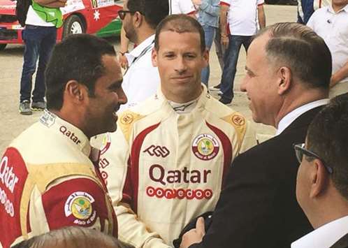 Qataru2019s Nasser Saleh al-Attiyah (left) and Matthieu Baumel (centre) with chairman of Jordan Motorsport Prince Feisal al-Hussein.
