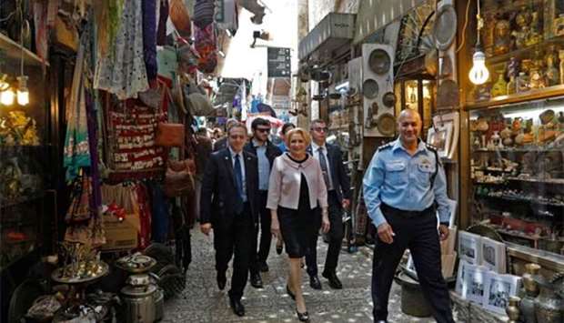 Romanian Prime Minister Viorica Dancila walks down the main market street in the old city of Jerusalem on Thursday.